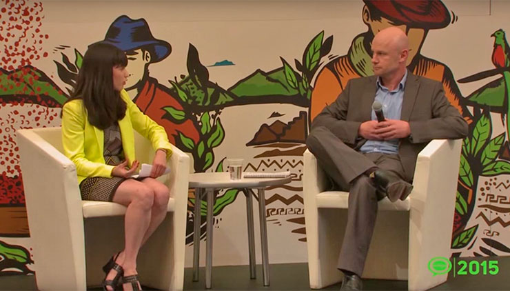 Two people seated at a table for an interview