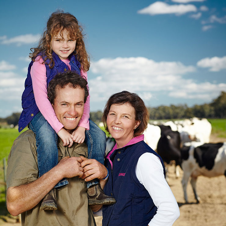 Stewart and Rebecca Cole for Riverina Fresh Ladysmith A family standing in front of cows