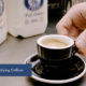 Small cup of coffee made with text "demystifying coffee"